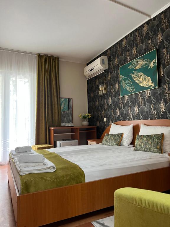 Postel nebo postele na pokoji v ubytování Hotel Violeta