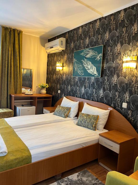 Postel nebo postele na pokoji v ubytování Hotel Violeta