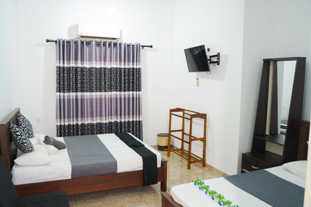Postel nebo postele na pokoji v ubytování PEREGRINE Villa