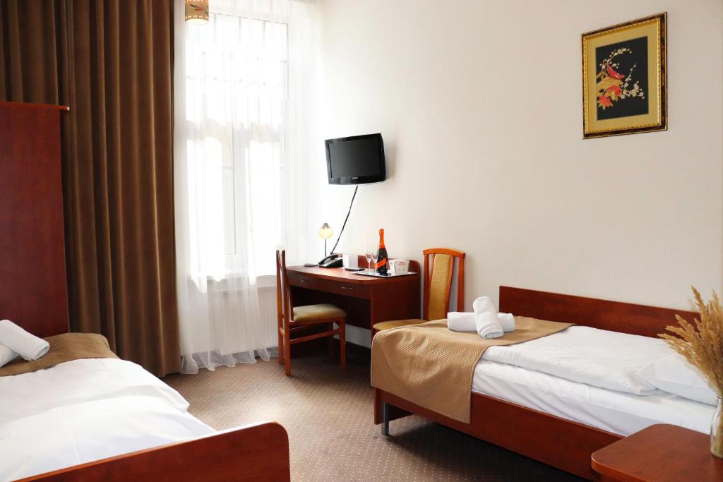 Posteľ alebo postele v izbe v ubytovaní Hotel Lothus