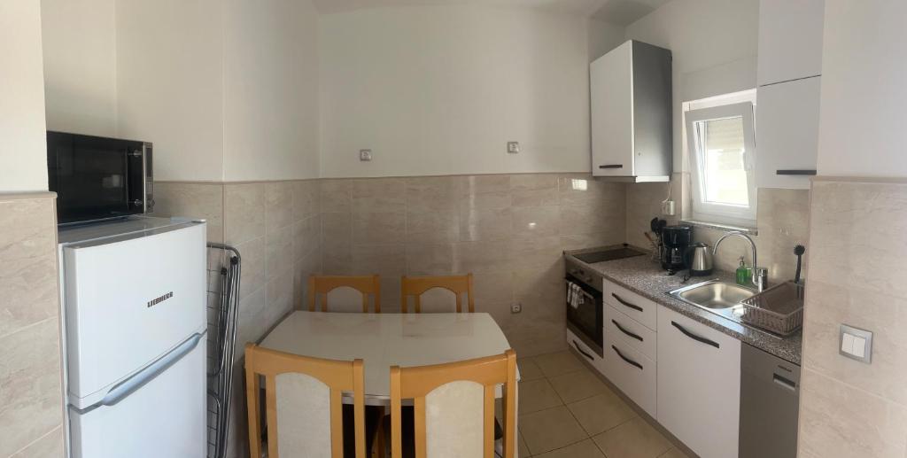 Kuchyňa alebo kuchynka v ubytovaní Apartments Nicole Wera