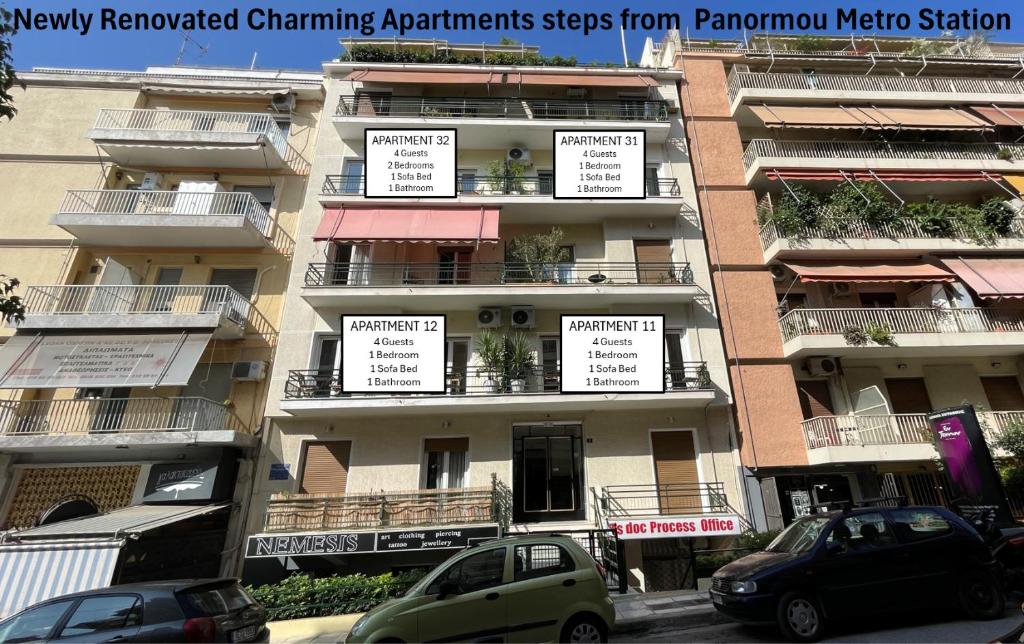 a tall apartment building with signs on its balconies at 4 Newly Renovated Charming Apartments steps from Panormou Metro Station in Athens