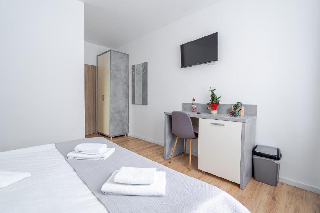 Postel nebo postele na pokoji v ubytování Casa Bucegi Busteni