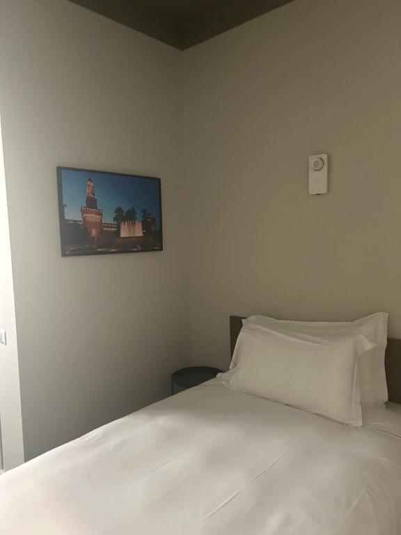 Postel nebo postele na pokoji v ubytování Hotel 22 Marzo