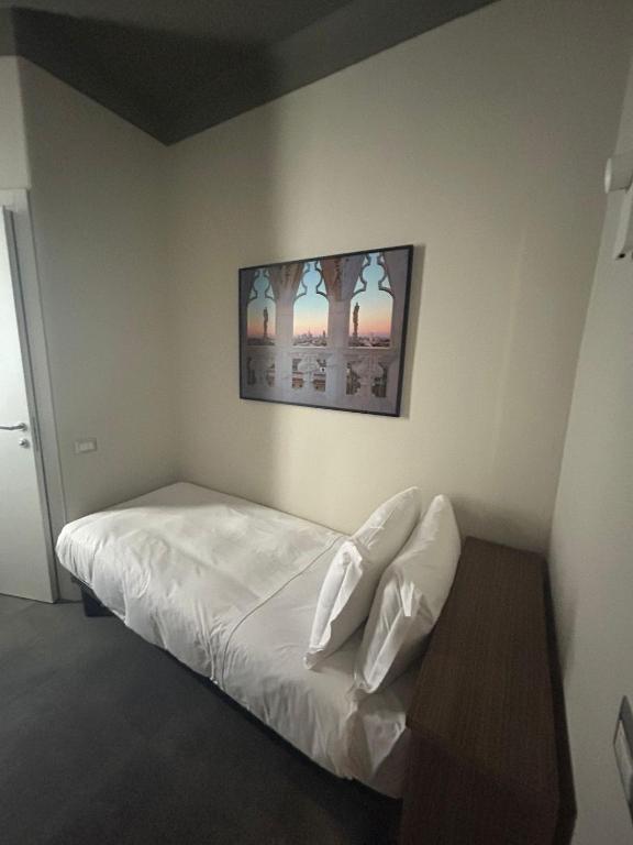 Postel nebo postele na pokoji v ubytování Hotel 22 Marzo