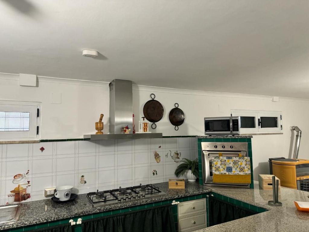 Kuchyň nebo kuchyňský kout v ubytování La Villa Carmela Cuma