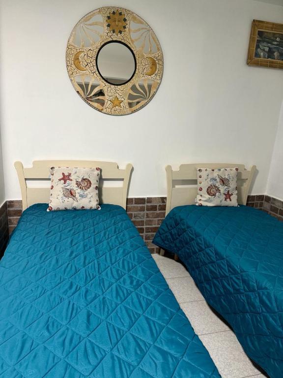 Postel nebo postele na pokoji v ubytování La Villa Carmela Cuma