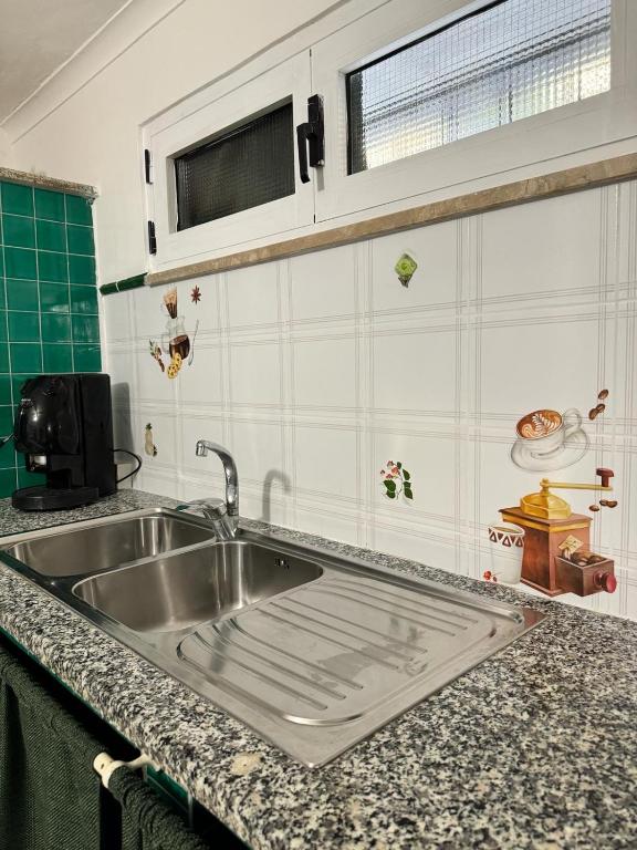 Kuchyň nebo kuchyňský kout v ubytování La Villa Carmela Cuma