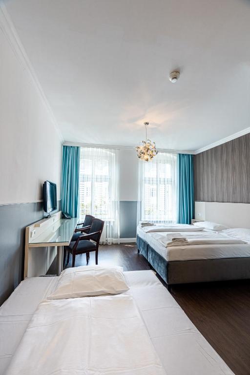 Postel nebo postele na pokoji v ubytování Hotel Prens Berlin
