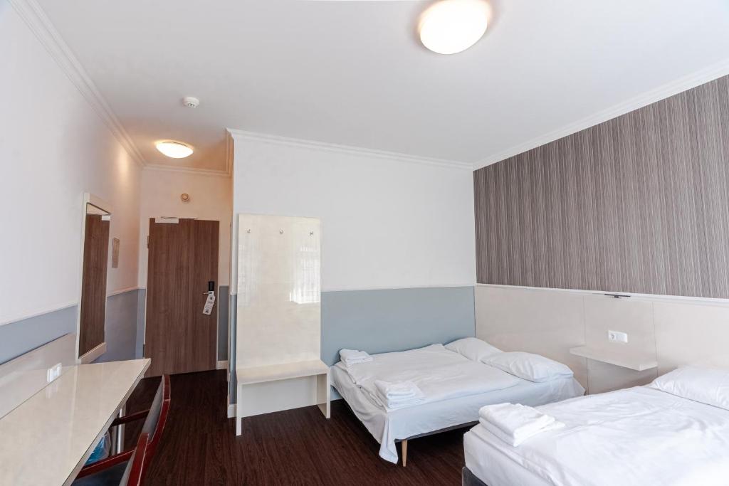 Postel nebo postele na pokoji v ubytování Hotel Prens Berlin