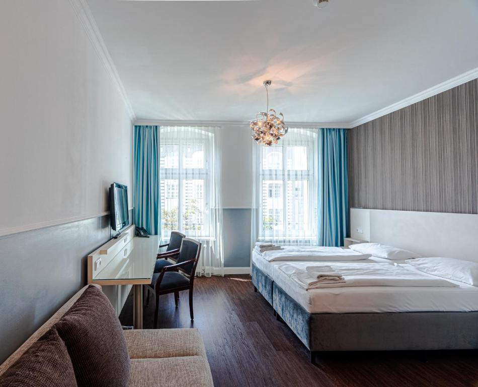 Postel nebo postele na pokoji v ubytování Hotel Prens Berlin