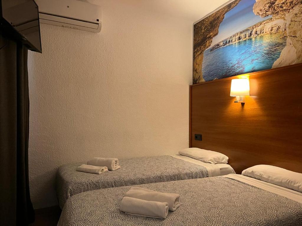 Postel nebo postele na pokoji v ubytování Hotel Maremagnum