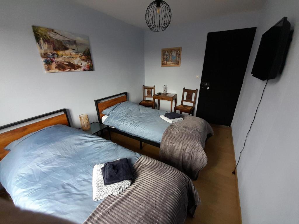 Postel nebo postele na pokoji v ubytování Le Bras d'Or