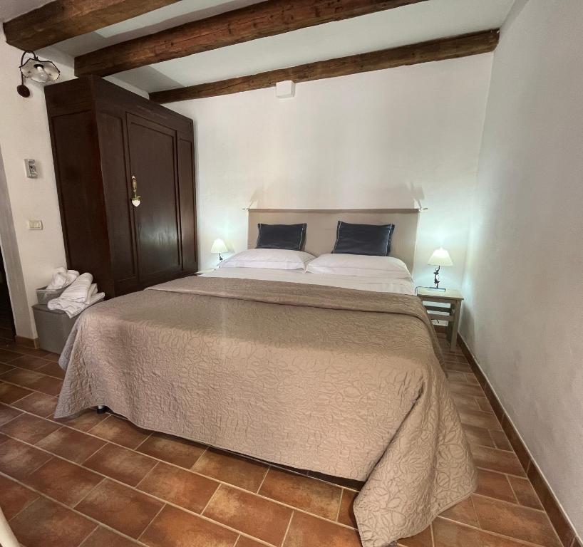 a bedroom with a large bed in a room at Casa Lambertina in Senigallia