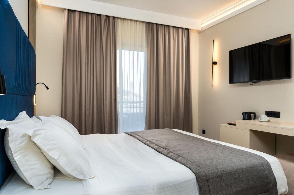Postel nebo postele na pokoji v ubytování Palatino Hotel