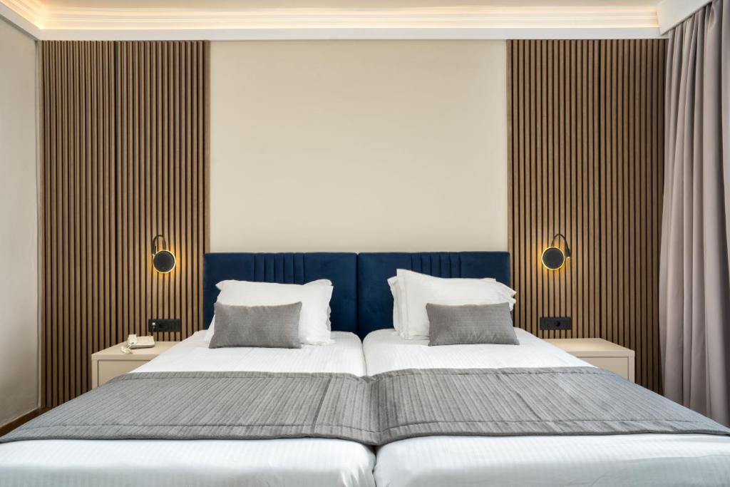 Postel nebo postele na pokoji v ubytování Palatino Hotel