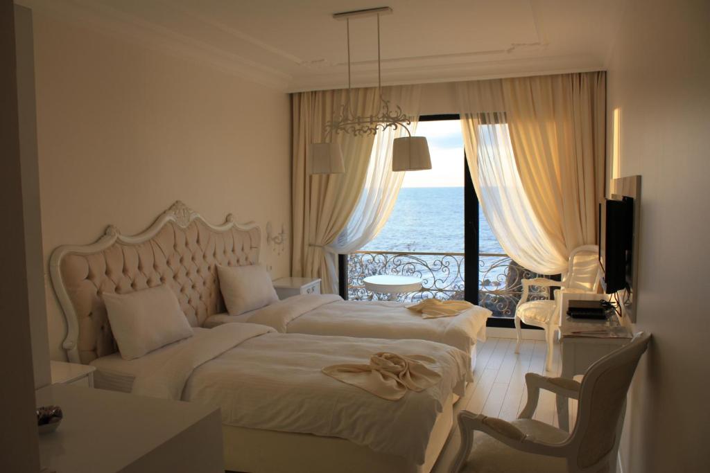 Ένα ή περισσότερα κρεβάτια σε δωμάτιο στο Bab-i Zer Hotel