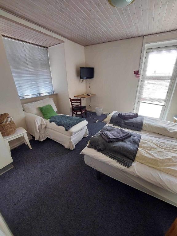 Postel nebo postele na pokoji v ubytování Grenaa Hostel