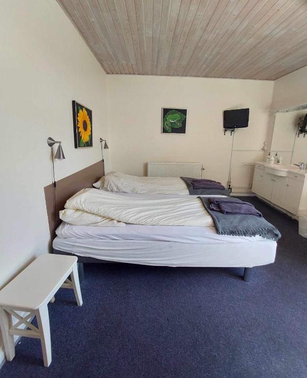 Postel nebo postele na pokoji v ubytování Grenaa Hostel