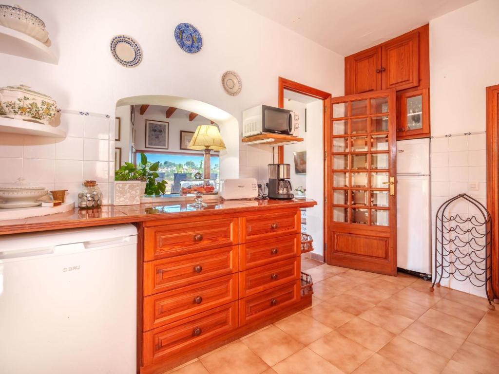 Kuchyň nebo kuchyňský kout v ubytování Holiday Home Cala Mendia Sea Views by Interhome