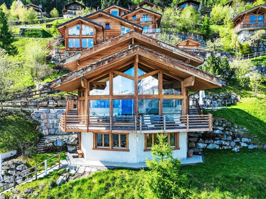 an image of a log house on a hill at Chalet Chalet Aquarius by Interhome in Nendaz