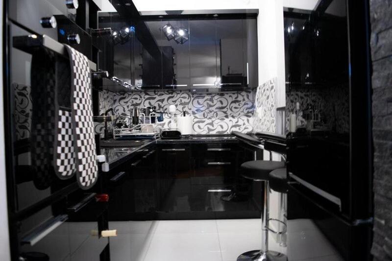 TV a/nebo společenská místnost v ubytování Central Heights - City View Apartment