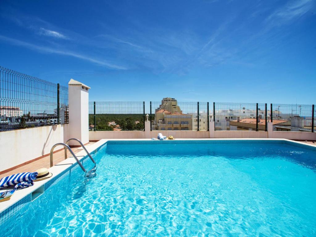 a swimming pool on the roof of a building at Apartment Navegante by Interhome in Monte Gordo