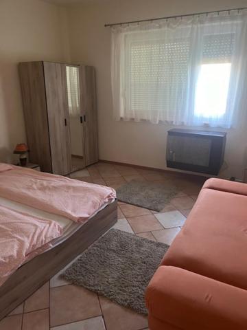 Łóżko lub łóżka w pokoju w obiekcie Dyta2 apartman