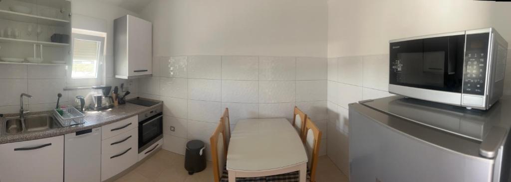 Kuchyňa alebo kuchynka v ubytovaní Apartments Nicole Wera