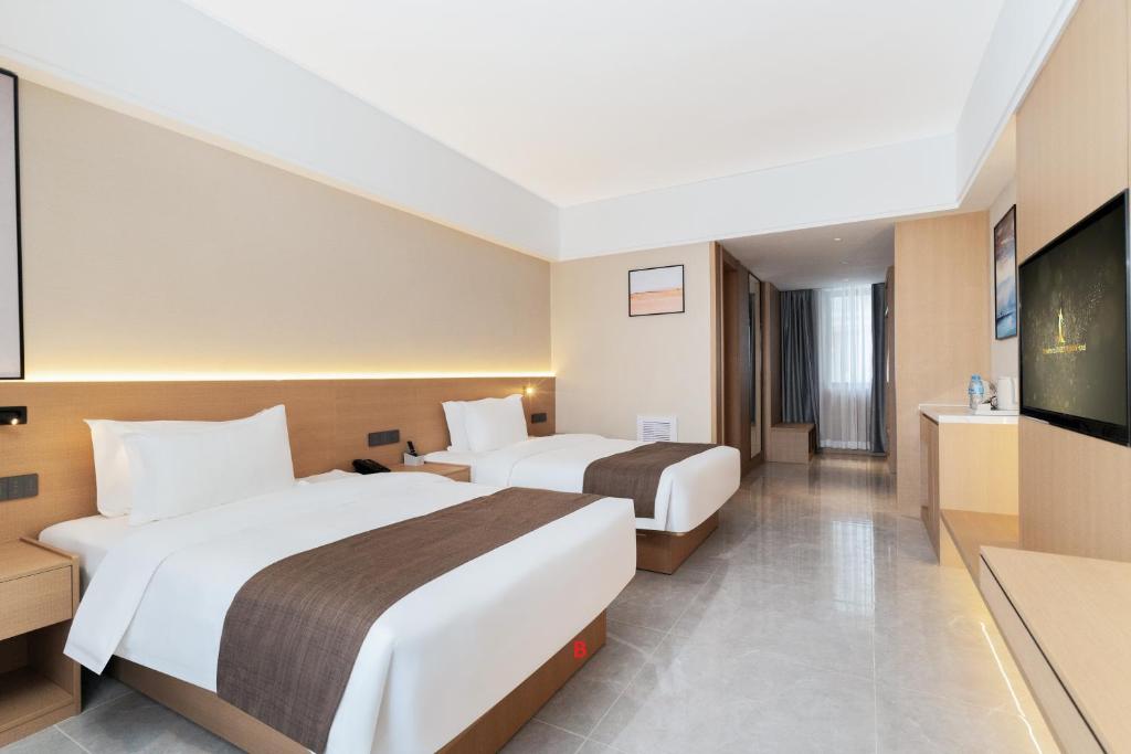Postel nebo postele na pokoji v ubytování JD POLMAN Hotel