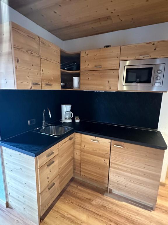 Kuchyň nebo kuchyňský kout v ubytování Alpen Hotel Chalet