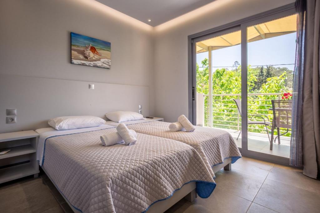 Postel nebo postele na pokoji v ubytování Casa Di Mare - Studios and Apartments on the beach