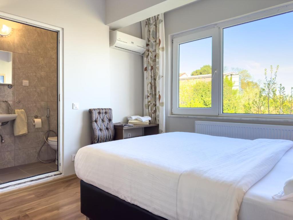 Postel nebo postele na pokoji v ubytování Yaylı Apart