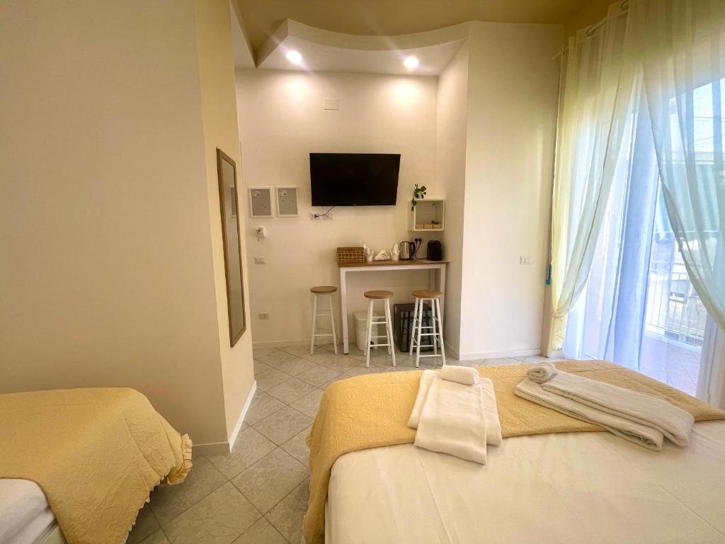 Postel nebo postele na pokoji v ubytování Terrazza Garibaldi