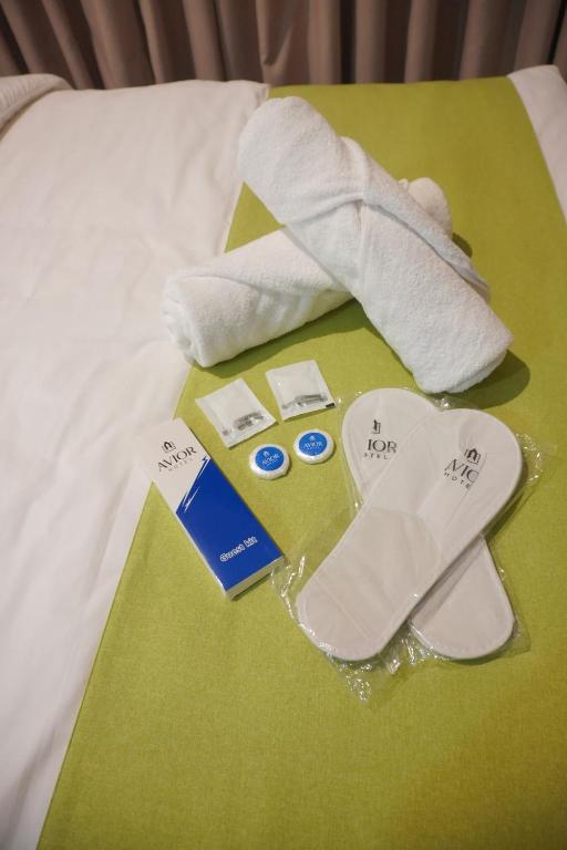 Postel nebo postele na pokoji v ubytování Avioré Hotel Tacloban