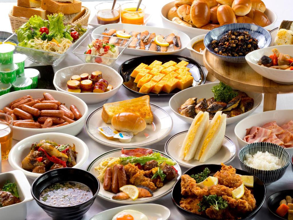 a table topped with lots of different types of food at Hotel Hillarys in Osaka