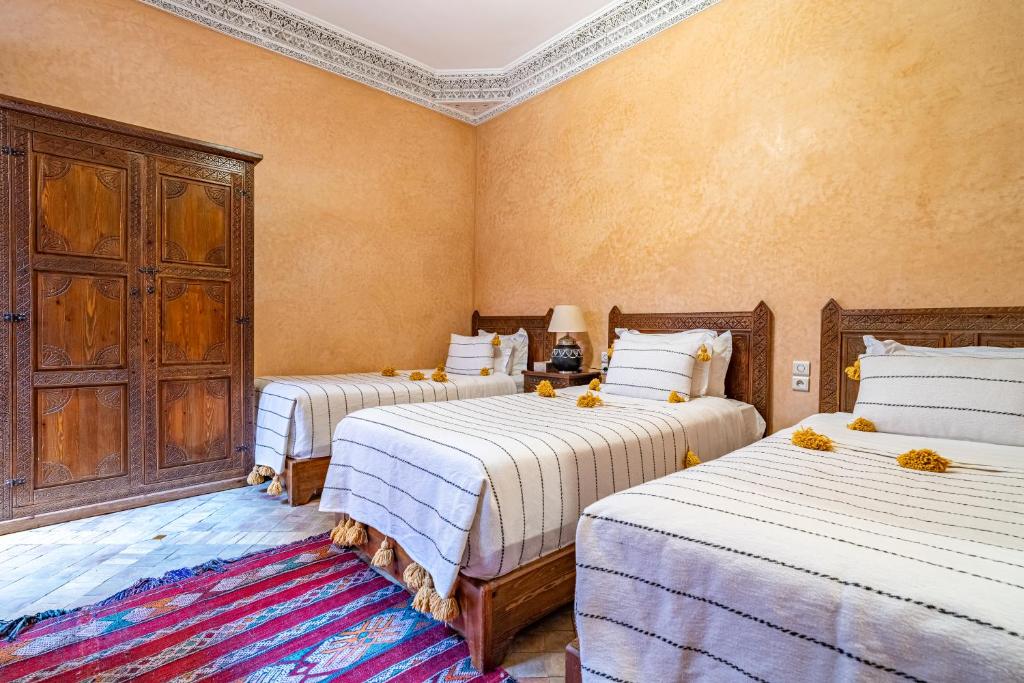 Postel nebo postele na pokoji v ubytování RIAD VILLA SIDI BABA