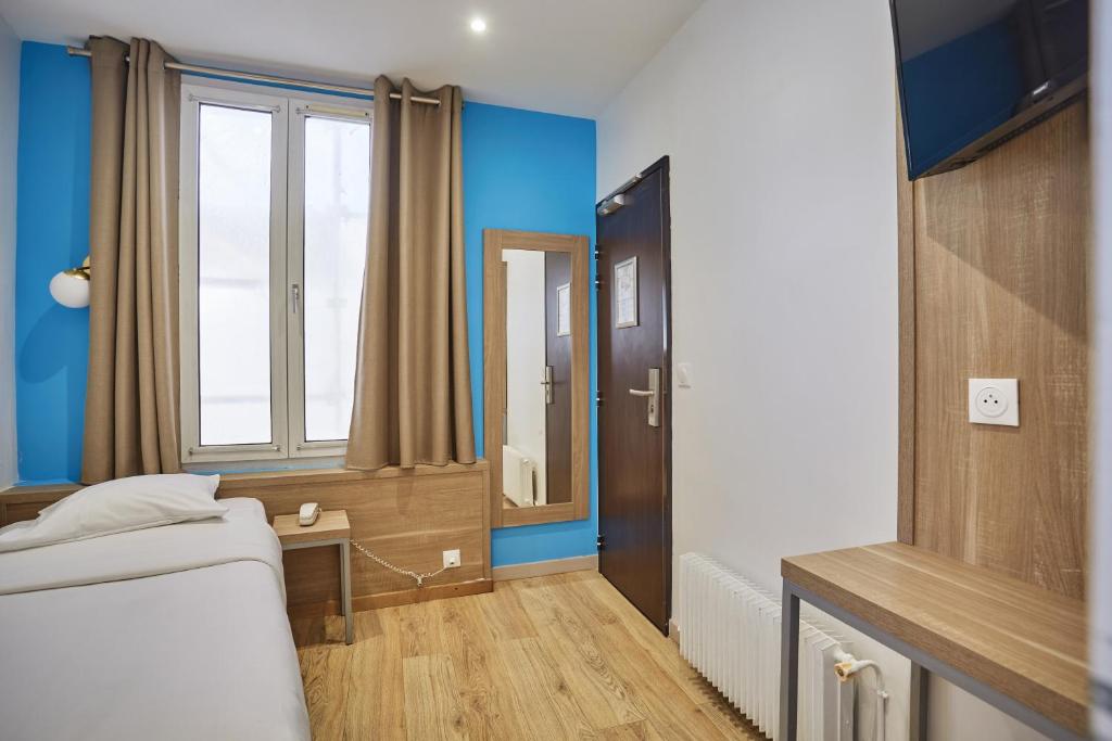 TV a/nebo společenská místnost v ubytování Merryl Hotel