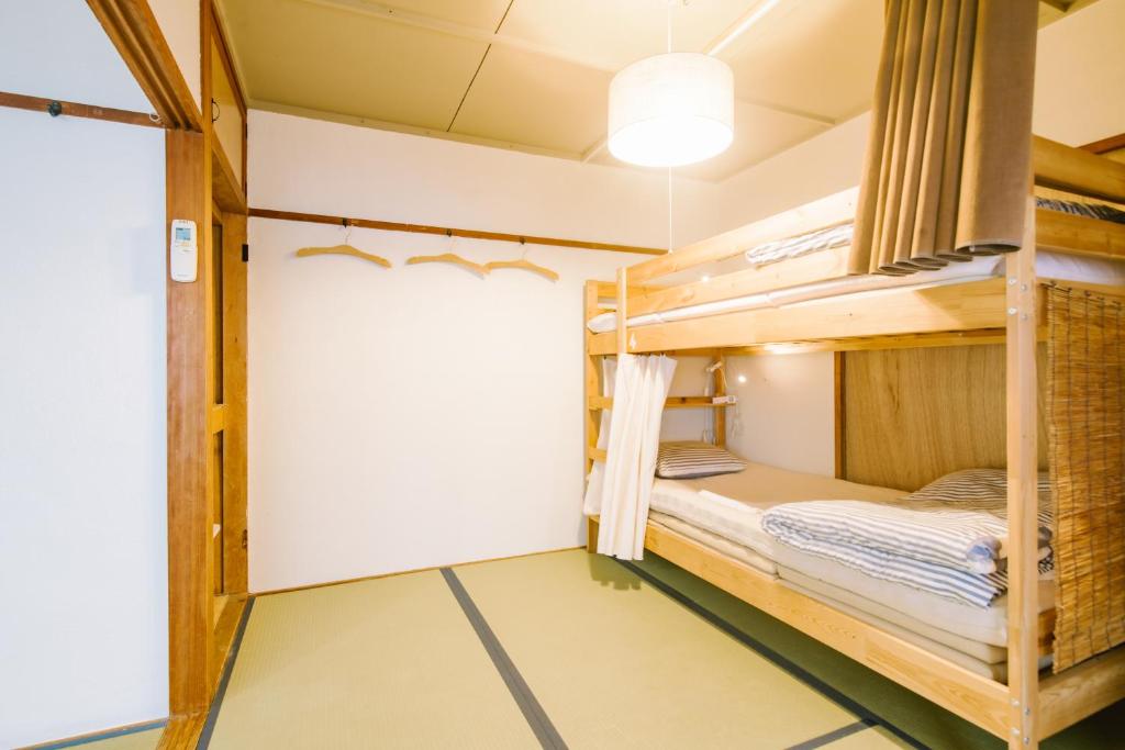 Postel nebo postele na pokoji v ubytování Guesthouse RICO