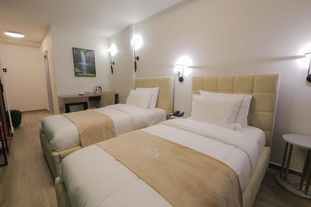 Postel nebo postele na pokoji v ubytování Olia Residence