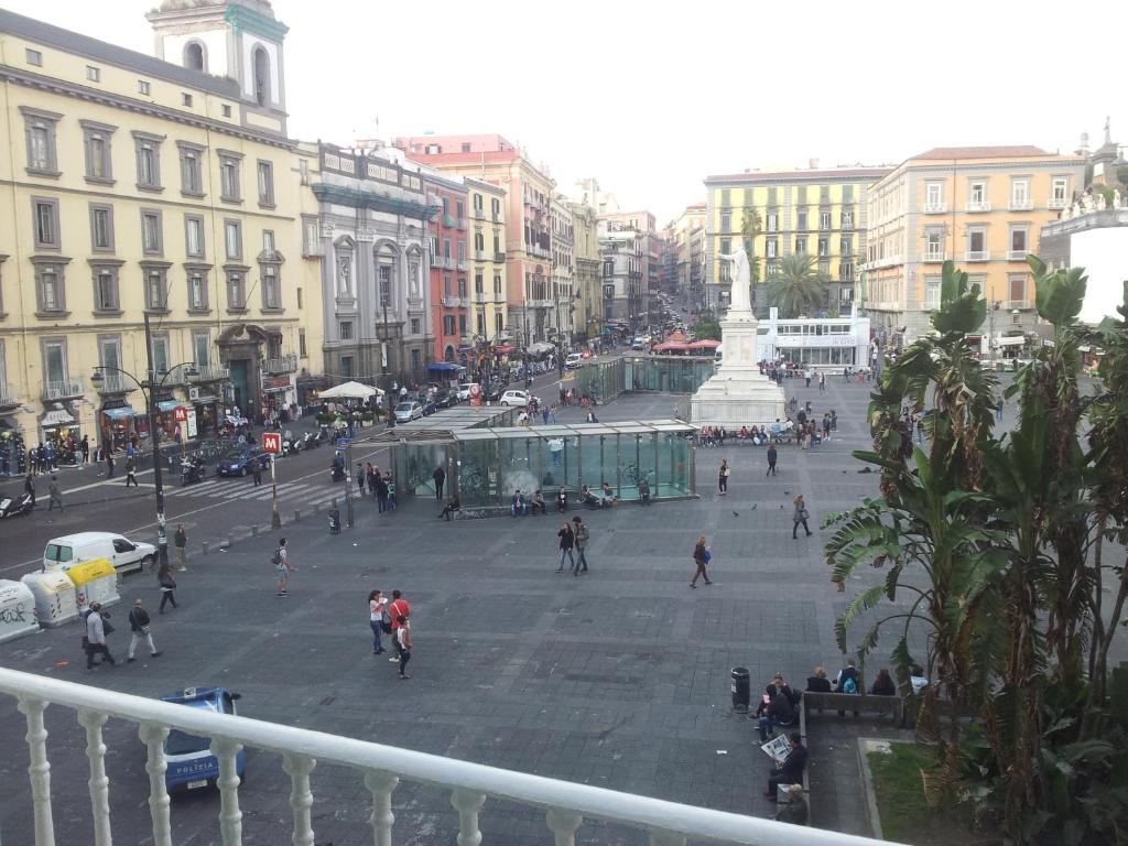 a group of people walking around a city street at B&B Graziani Relais in Naples