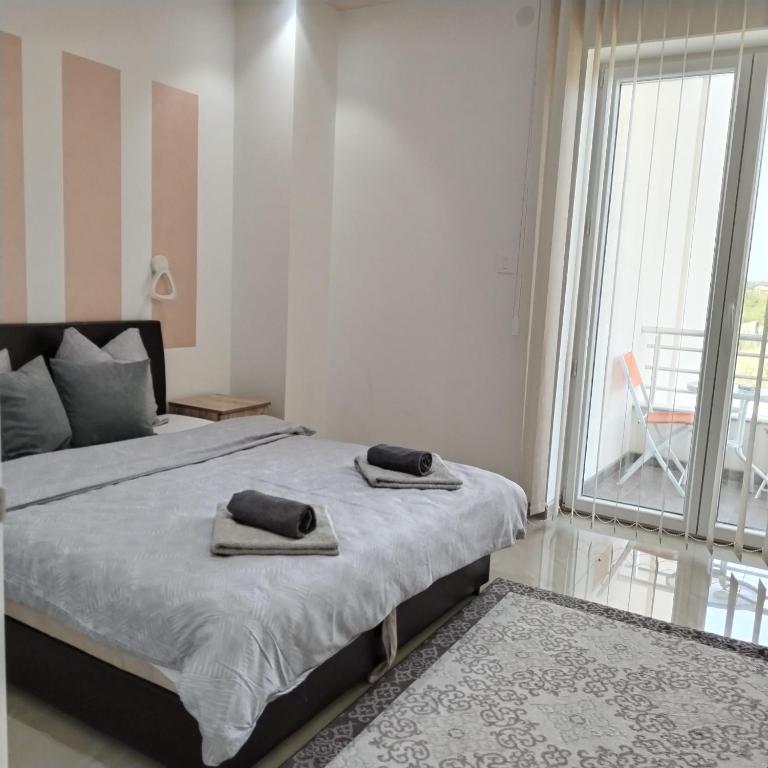 Postel nebo postele na pokoji v ubytování Kristal Apartmani - Banja Ždrelo