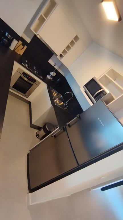 Kuchyň nebo kuchyňský kout v ubytování Edificio Grimm