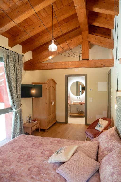 Postel nebo postele na pokoji v ubytování Agriturismo La Rosarnetta