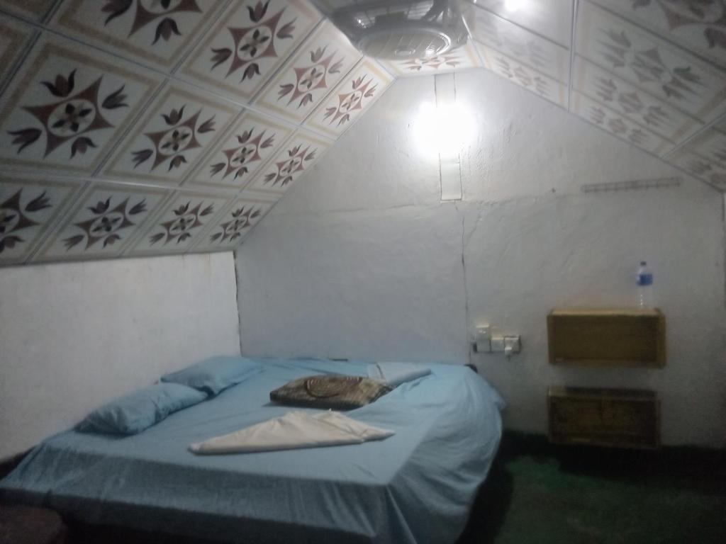 Postel nebo postele na pokoji v ubytování Riverpark Guesthouse Arugambay