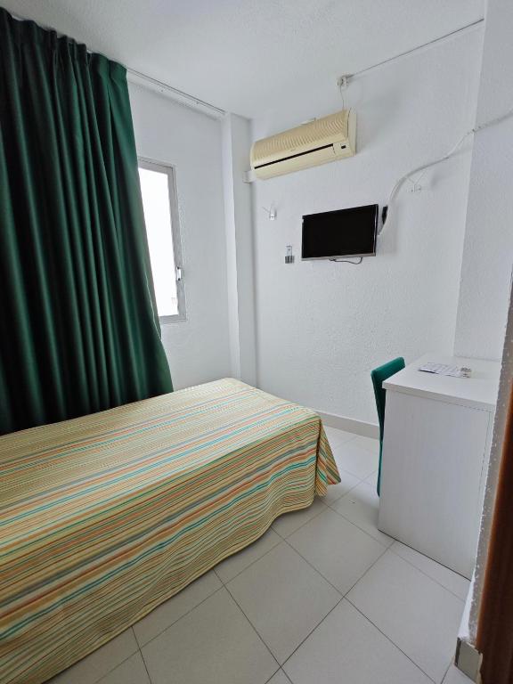 Postel nebo postele na pokoji v ubytování Hotel Camposol