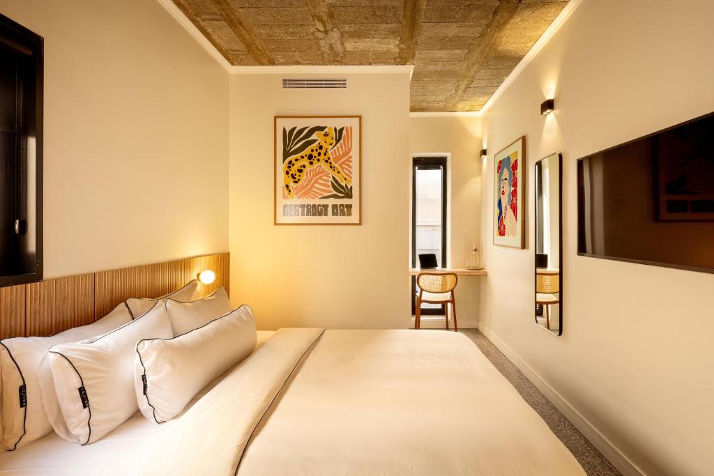 Postel nebo postele na pokoji v ubytování Savanna - by Loginn Tel-Avivian hotels