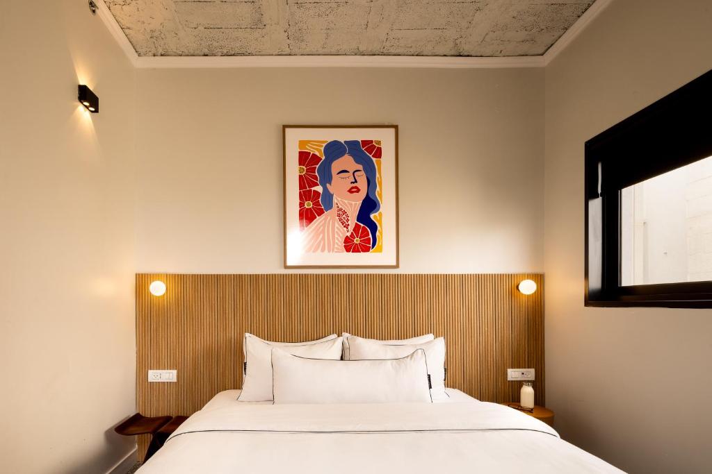 Postel nebo postele na pokoji v ubytování Savanna - by Loginn Tel-Avivian hotels
