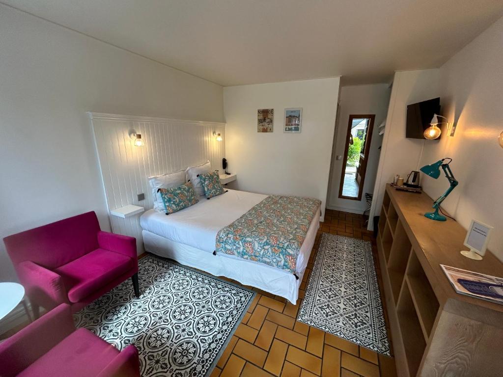 Postel nebo postele na pokoji v ubytování Hôtel Monet