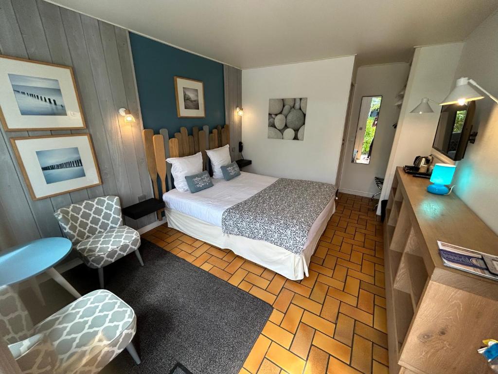 Postel nebo postele na pokoji v ubytování Hôtel Monet